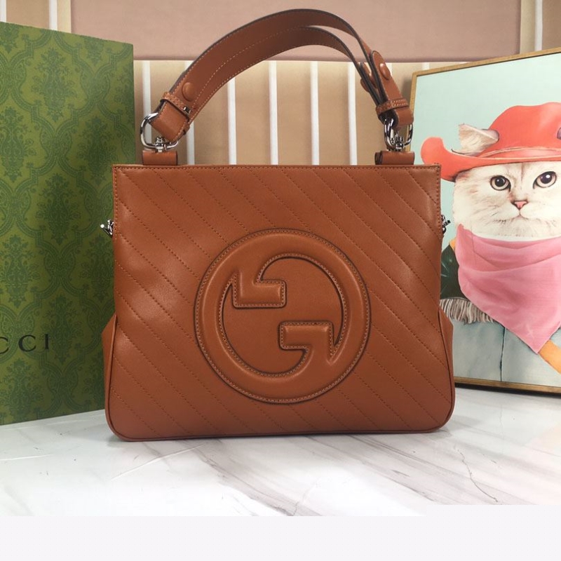 G*u*i top handle bags